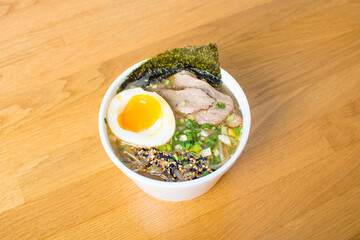 Bowl of Hot and Sour Beef Broth With Spinach Ramen Noodles