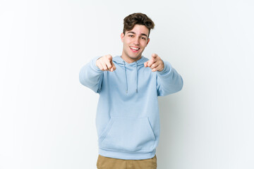 Young caucasian man isolated on white background cheerful smiles pointing to front.