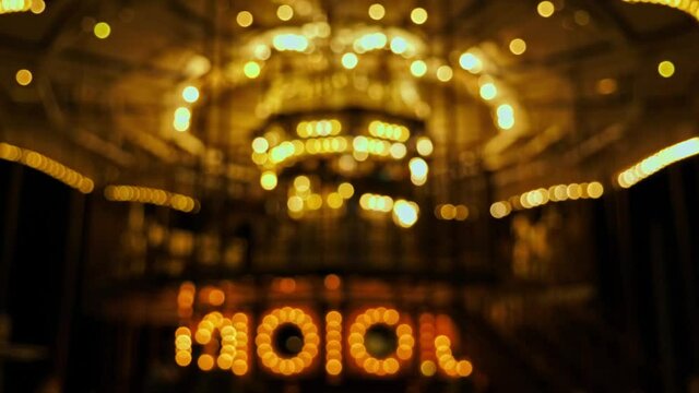 4k footage ; blurry of motion circle light or called 'bokeh' of carousel in amusement park.