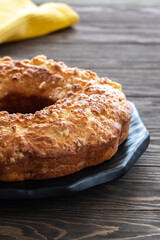Delicious and fragrant crispy cupcake with apple pieces on a wooden table