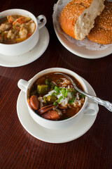 Gumbo. Jumbo shrimp, clam, mussels. lobster tail, crab claws cooked in seafood broth with corn on the cob and an assortment of vegetables and served with fluffy white rice. 