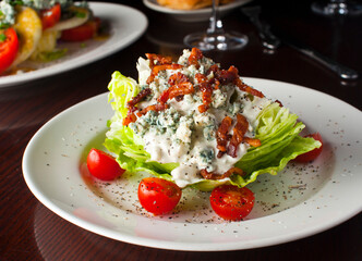 Wedge Salad. Iceberg Lettuce, blue cheese dress and shredded carrots. Classic American steakhouse or restaurant favorite. 