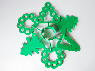 green plastic tree on a white background
