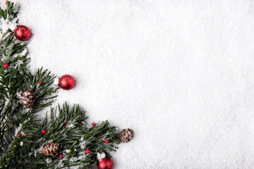 Festive Christmas decorations on snowy background
