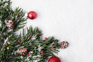 Obraz na płótnie Canvas Festive Christmas decorations on snowy background