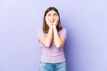 Young caucasian woman whining and crying disconsolately.