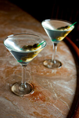 Old Fashioned Cocktail. Traditional American craft cocktails made by artisanal bartenders or mixologists in speakeasy & upscale bars or dive bar taverns. Cocktails served in chilled cocktail glass.