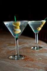 Old Fashioned Cocktail. Traditional American craft cocktails made by artisanal bartenders or mixologists in speakeasy & upscale bars or dive bar taverns. Cocktails served in chilled cocktail glass.