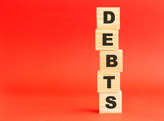 Wooden cubes with letters. Wooden cubes on a red background. Free space on the left.