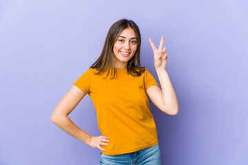 Fototapeta premium Young caucasian woman showing number two with fingers.