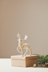 Christmas card conception. Christmas toy deer decoration with christmas tree branch and snow