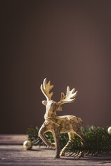 Christmas card conception. Christmas toy deer decoration with christmas tree branch and snow