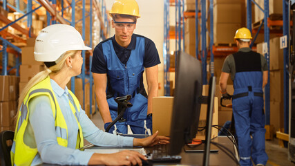In Retail Warehouse Manager Uses Computer with Inventory Checking Software, Talks with Storehouse...