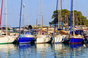Obraz premium White yachts in the sea harbor of Kemer, Antalya province in Turkey. Kemer Marina on the Mediterranean sea