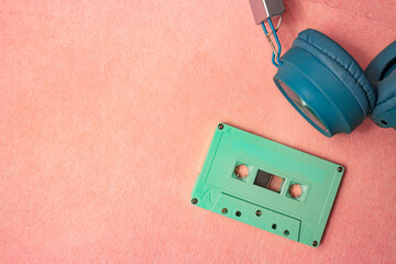 Retro green audio cassette tape and headphones