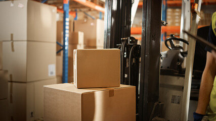 Big Retail Warehouse full of Shelves with Goods Stored on Manual Pallet Truck in Cardboard Boxes...