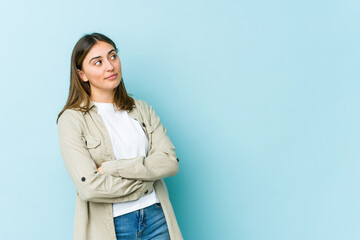 Young caucasian woman dreaming of achieving goals and purposes