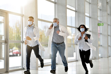 Medical team in emergency department rushing in hallway