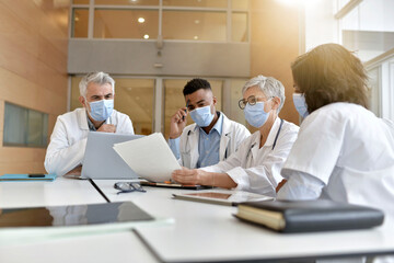 Medical staff meeting at the hospital during pandemic