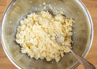 A raw mixture of eggs, cottage cheese and butter for cookies