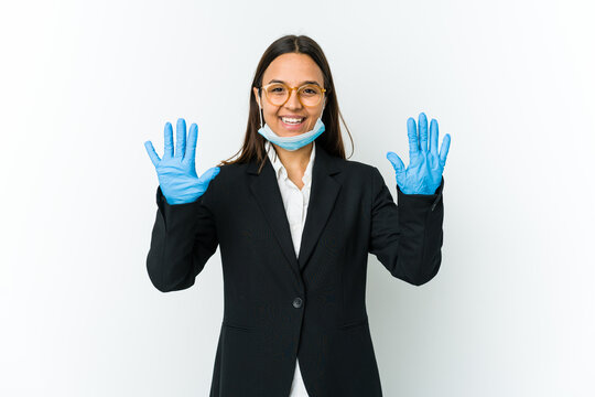 Young Business Latin Woman Wearing A Mask To Protect From Covid Isolated On White Background Showing Number Ten With Hands.