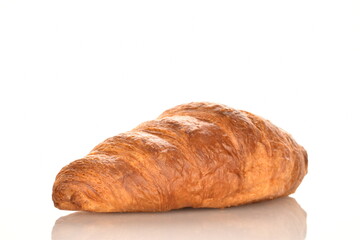 Fragrant homemade croissant, close-up, on a white background.