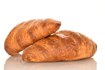 Fragrant homemade croissant, close-up, on a white background.