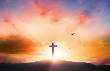 Fototapeta na wymiar Good Friday concept: Silhouette cross on mountain sunset background