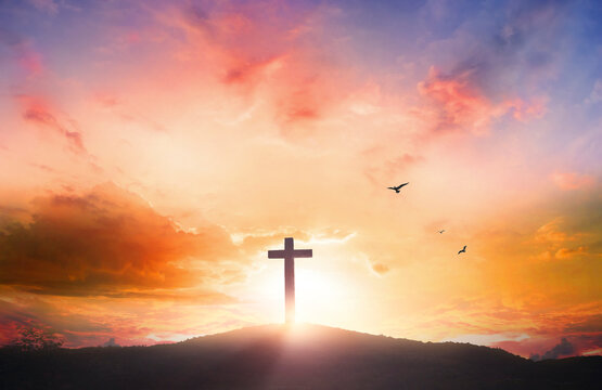 Good Friday concept: Silhouette cross on  mountain sunset background