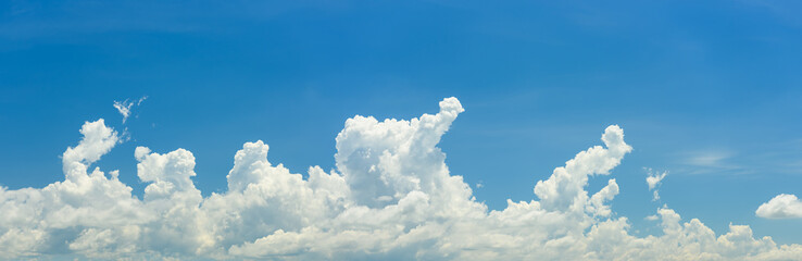 Naklejka na ściany i meble Panoramic of white clouds on blue sky