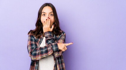Young mixed race hispanic woman isolated pointing to the side