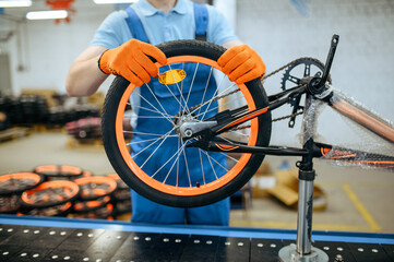 Bicycle factory, assembly line, wheel installation