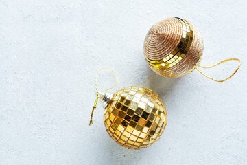 Christmas golden baubles on bright
