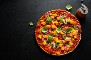 Pizza with pumpkin chunks with vegetables