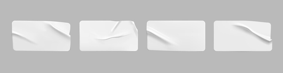 White glued crumpled rectangle stickers mock up set. Blank white adhesive paper or plastic sticker label with wrinkled and creased effect. Template label tags close up. 3d realistic vector