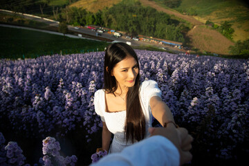 Beautiful girl in white dress in Margaret flower fields. Lifestyle Concept