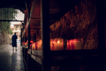 Church candles that illuminate a dark path in a cove