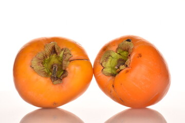 Ripe juicy organic persimmon, close-up, on a white background.