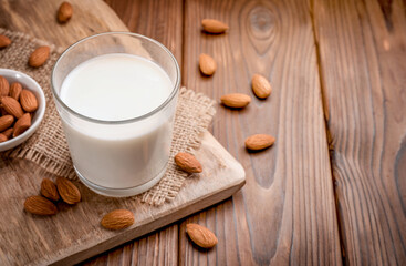Fototapeta na wymiar Almond milk and almond nuts