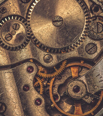 Details of an old mechanical watch close-up. Selective focus on details. Grunge background of vintage clock elements