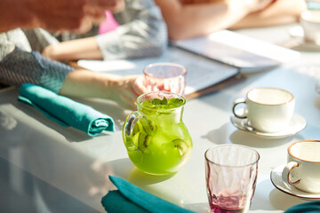 close-up photo of sweet delicious beverages on table in restaurant, kiwi juice for customers