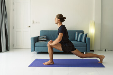 Man doing stretching exercises on a mat
