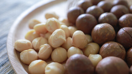 Organic Macadamia nut. macadamia nuts are cracked and baked to taste extremely delicious superfood fresh natural shelled unsalted raw macadamia and healthy food concept