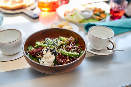 close-up photo of salad in plate in restaurant, tasty delicious food on dish. organic healthy food