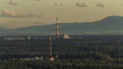 Chimneys of Silesian factories against the background of the Skrzyczne mountains in the Silesian Beskids - obrazy, fototapety, plakaty