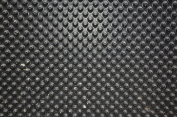 A black dimpled waterproofing foundation or basement membrane background. Water and moisture...