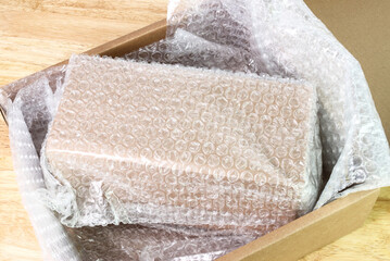 Bubbles covering the box by bubble wrap for protection product