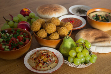 Traditional food of Israel on dark grey background with copy space. Colorful authentic meals top view photo. Healthy eating concept. 