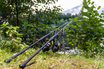 Two fishing rods with reels on stands, carp fishing