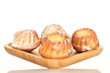 Fragrant sweet cupcakes, close-up, on a white background.
